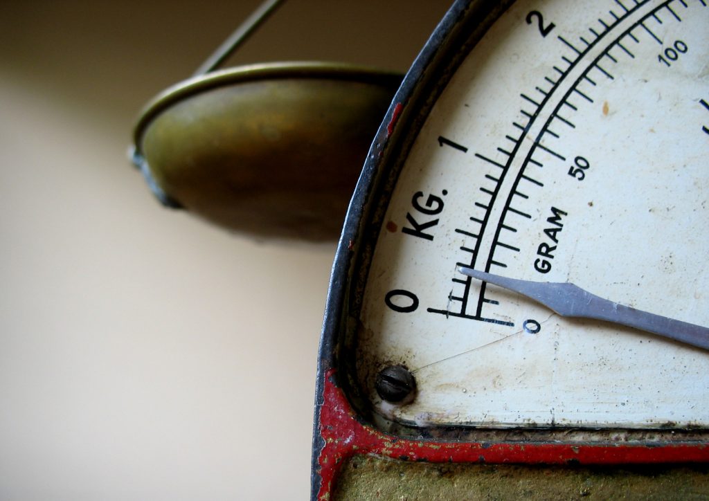 Carat is a unit of weight. Diamond laboratories use precision balances. An analog weighing scale