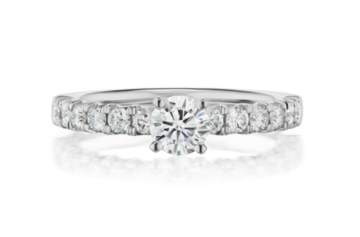 A setting can change the look and cost of the finished ring as much as the diamond size. A round diamond engagement ring with a pavé band