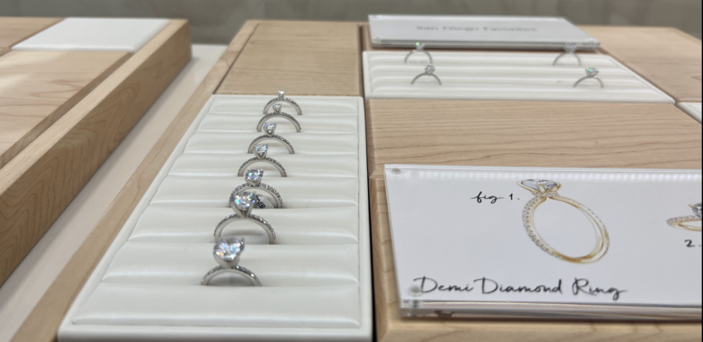 Compare the finished jewelry as well as the loose diamond. Diamond rings arranged in jewelry display trays