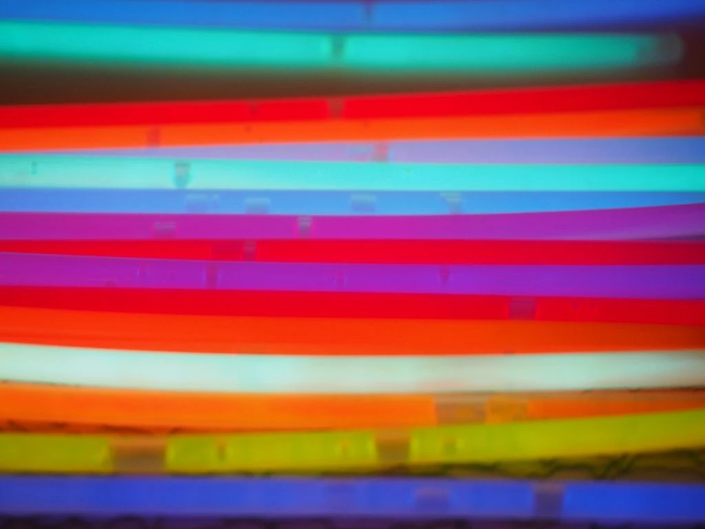 History of fluorescence in lab diamonds - glow sticks exhibit the same effect.