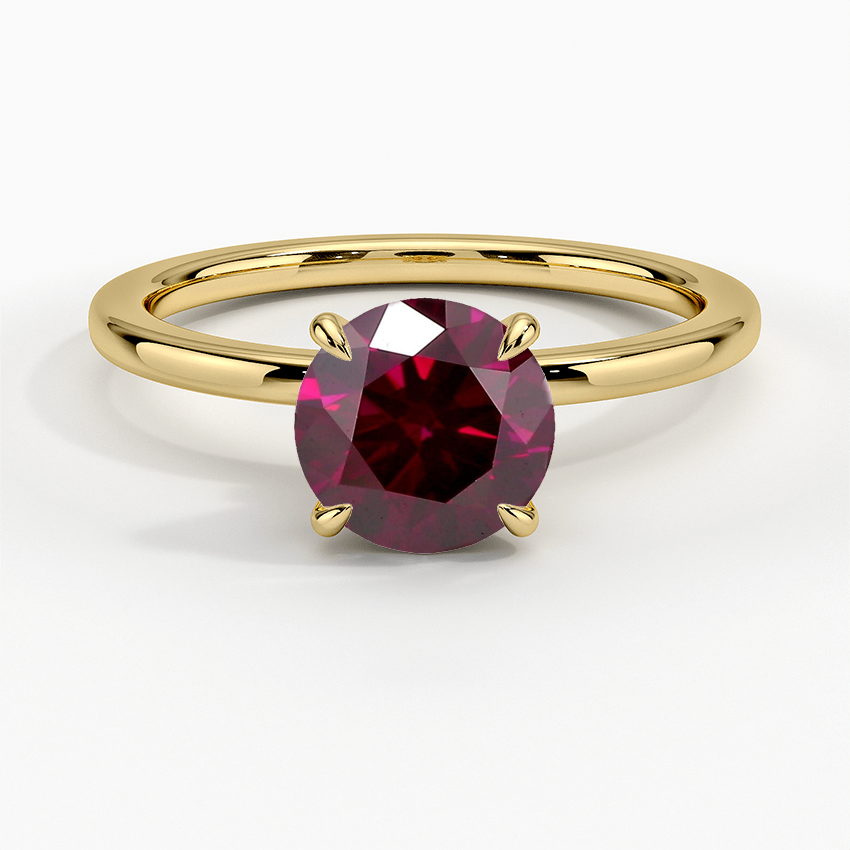 Red lab-grown diamond solitaire ring in yellow gold
