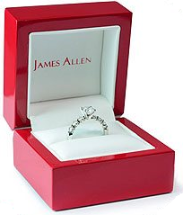 A diamond ring in a red James Allen presentation box