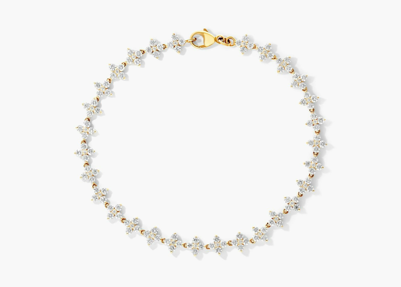 Yellow-gold bracelet with small diamond flower clusters and a lobster clasp