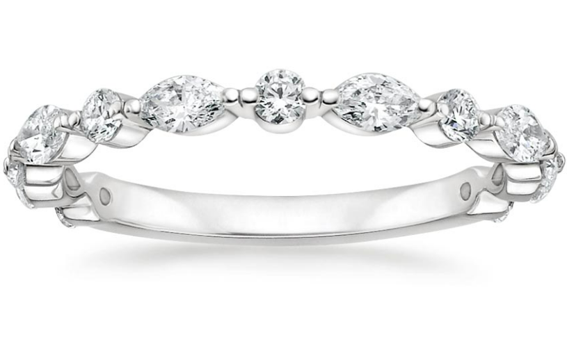 White-metal ring with alternating round and marquise diamonds across the band