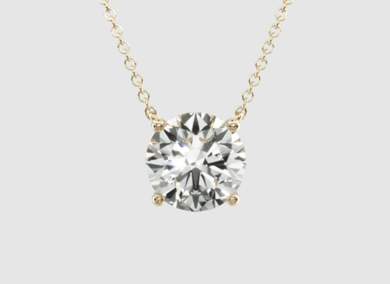 Single round diamond in a four-prong yellow-gold basket on a chain