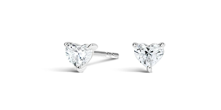 Two small heart-shaped diamonds in white-metal stud settings