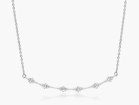 Five round diamond stations spaced along a curved section of white-metal chain