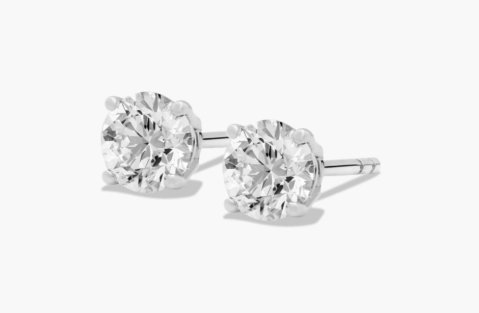 Round diamond stud earrings in four-prong white-metal basket settings