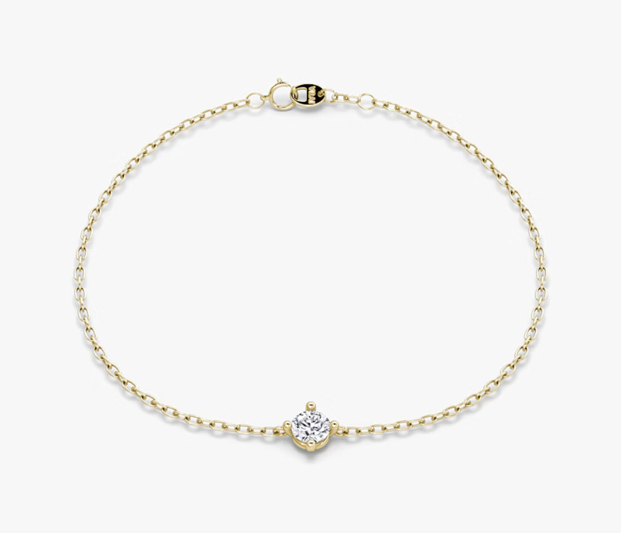Fine yellow-gold chain bracelet with a small round diamond at its center