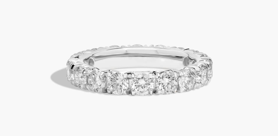 White-metal band with round diamonds in a French pave setting
