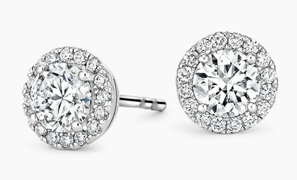 Round center diamonds surrounded by small diamond halos in white-metal studs