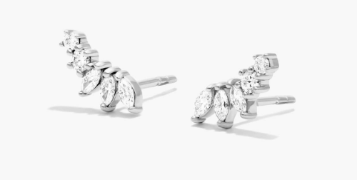 Marquise and small round diamonds following a short upward curve in white-metal earrings
