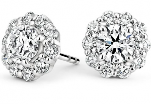 Round center diamonds surrounded by flower-shaped halo settings