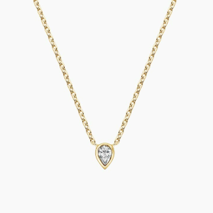 Small pear-shaped diamond in a yellow-metal bezel on a fine chain