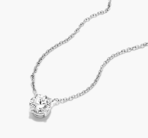 Round diamond in a white-metal prong pendant on a fine chain
