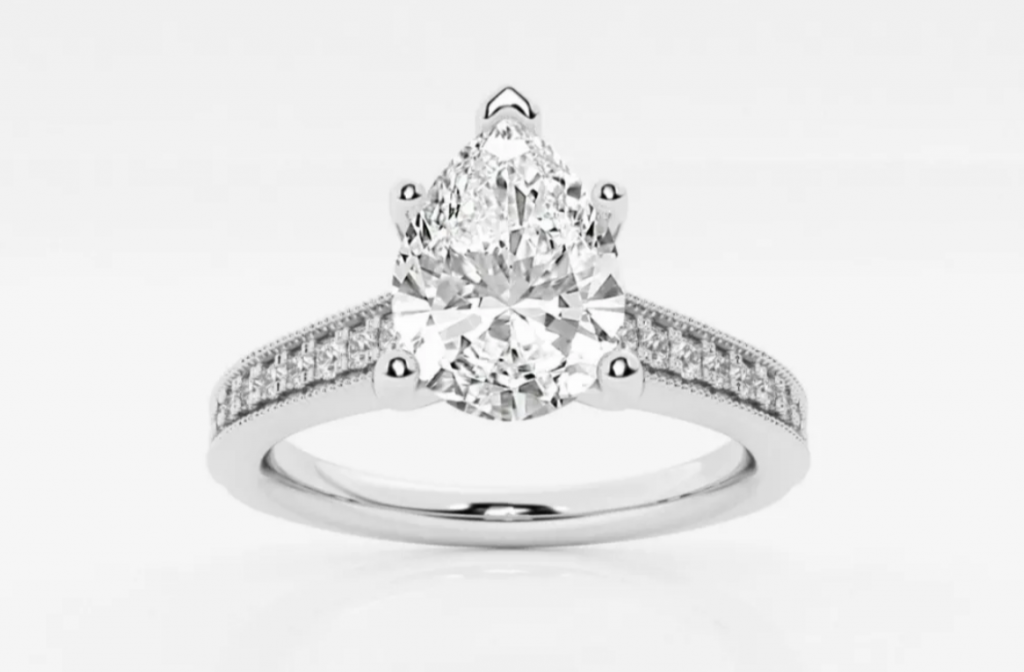 Pear-shaped center diamond on a band with small side accent diamonds
