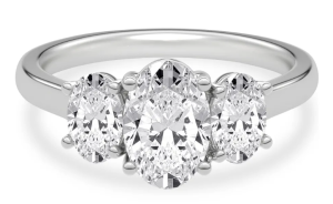 Three oval diamonds arranged across a white-metal ring