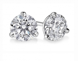Two round diamonds in three-prong white-metal stud settings