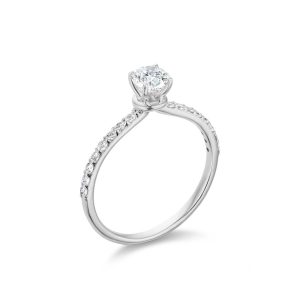 Round center diamond above an entwined white-metal ring gallery