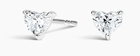 Two small heart-cut diamonds in white-metal stud settings