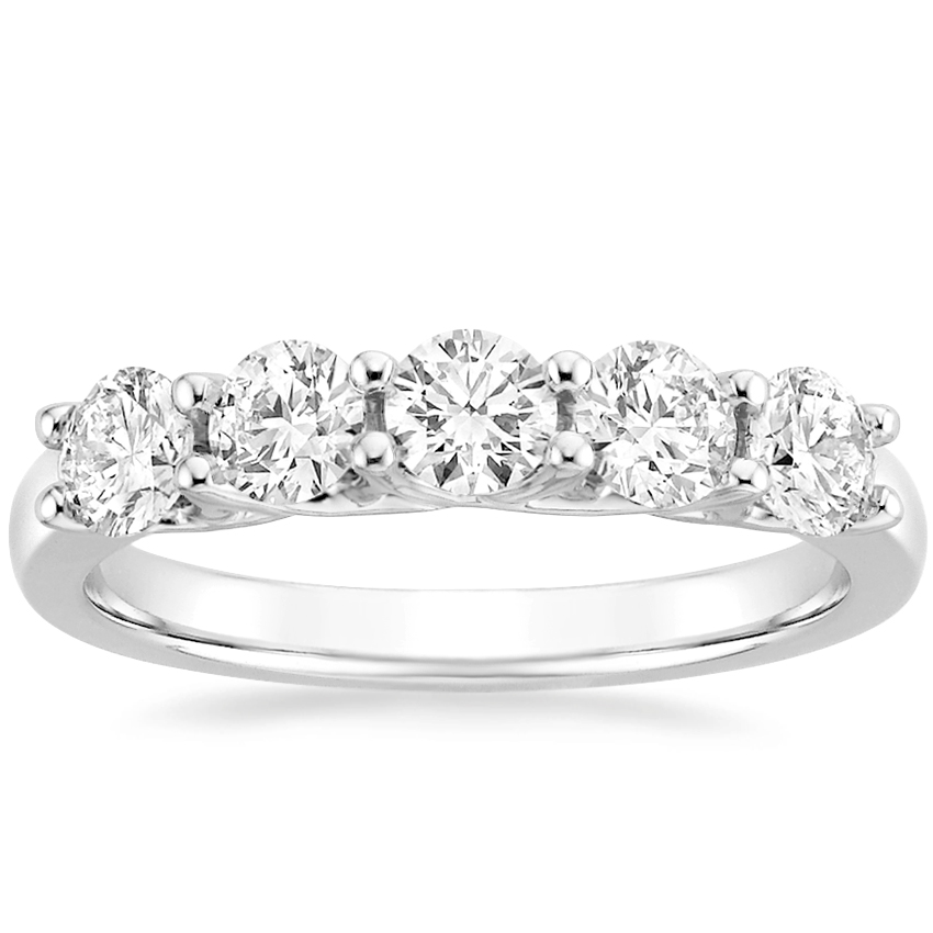 Five graduated round diamonds across a white-metal ring band
