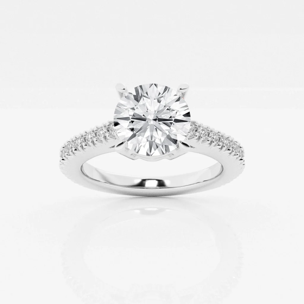 Round center diamond on a white-metal diamond-set engagement-ring band