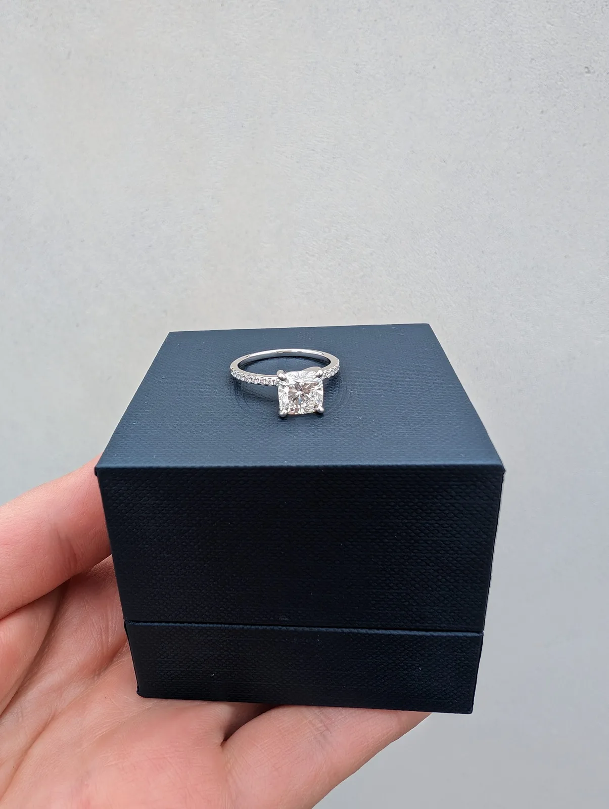 A close view of the cushion-cut diamond and pavé setting we chose. Close view of the cushion-cut lab-grown diamond ring purchased from Blue Nile