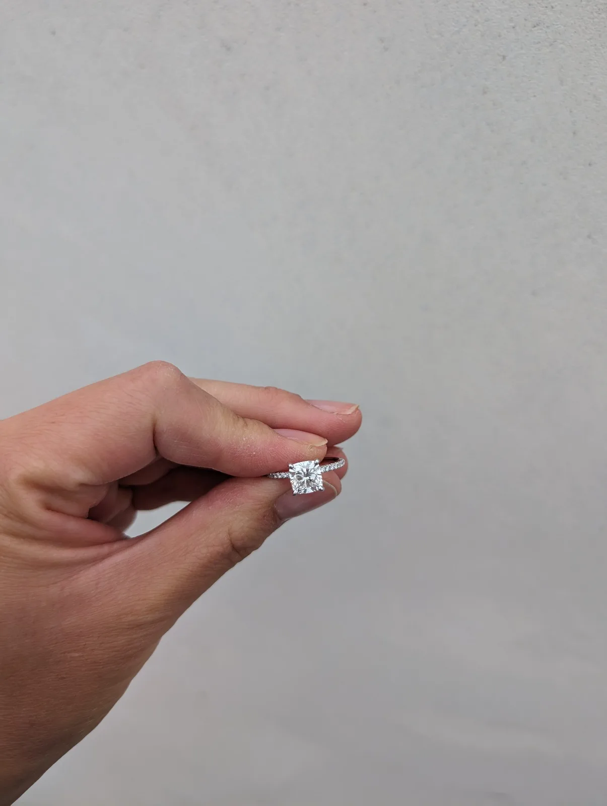 A close view of the diamond and pavé setting from our Blue Nile order. Close view of the Blue Nile lab-grown diamond engagement ring