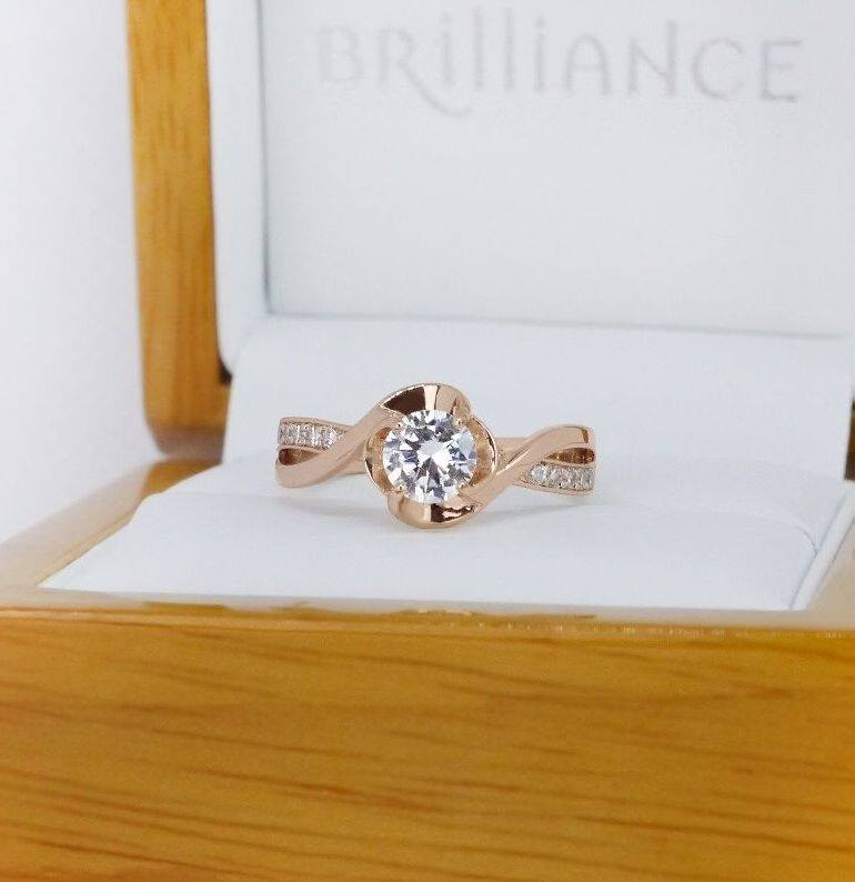 Round diamond ring in a Brilliance presentation box