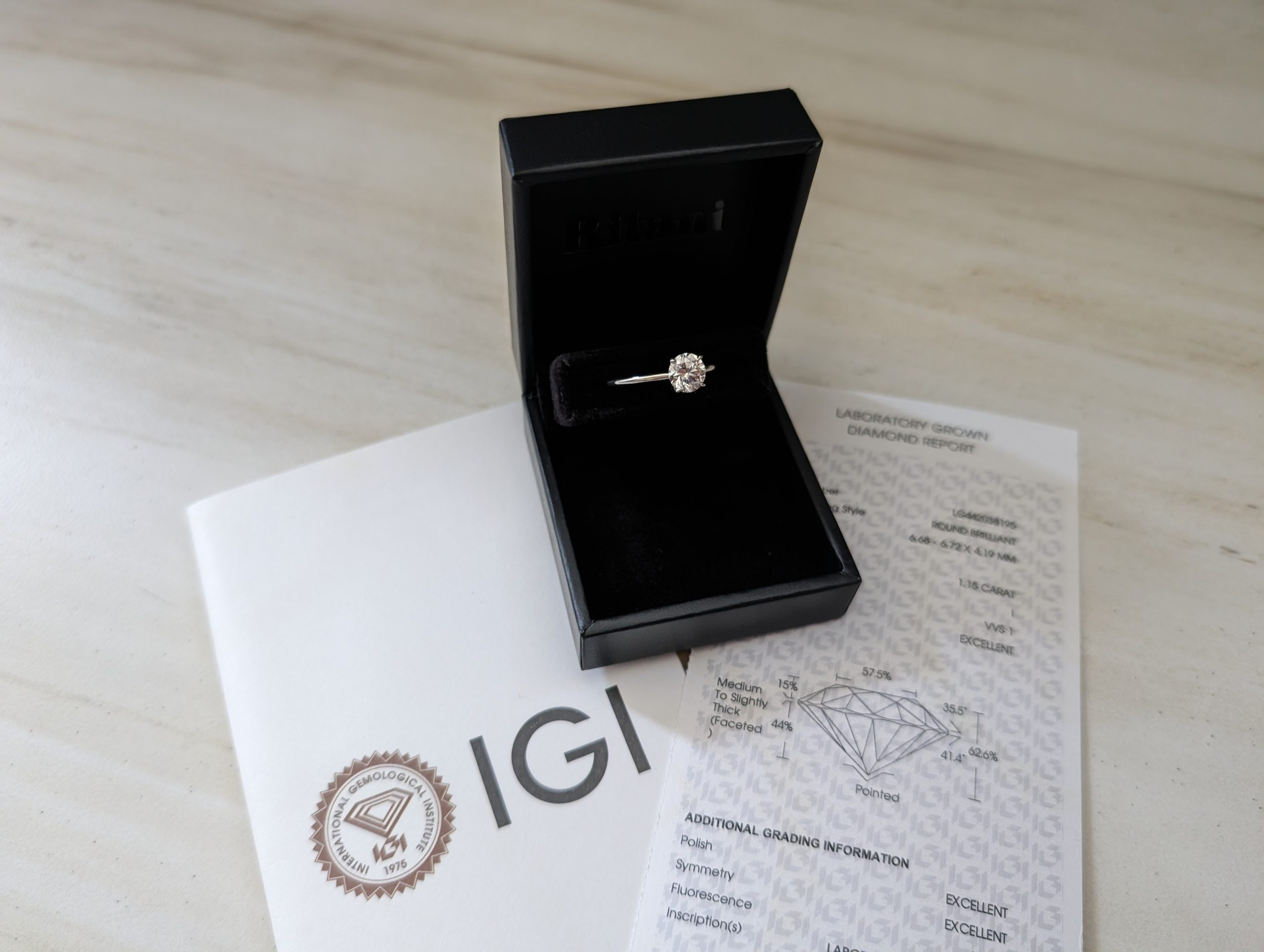 Ritani engagement ring from our test purchase with its IGI report