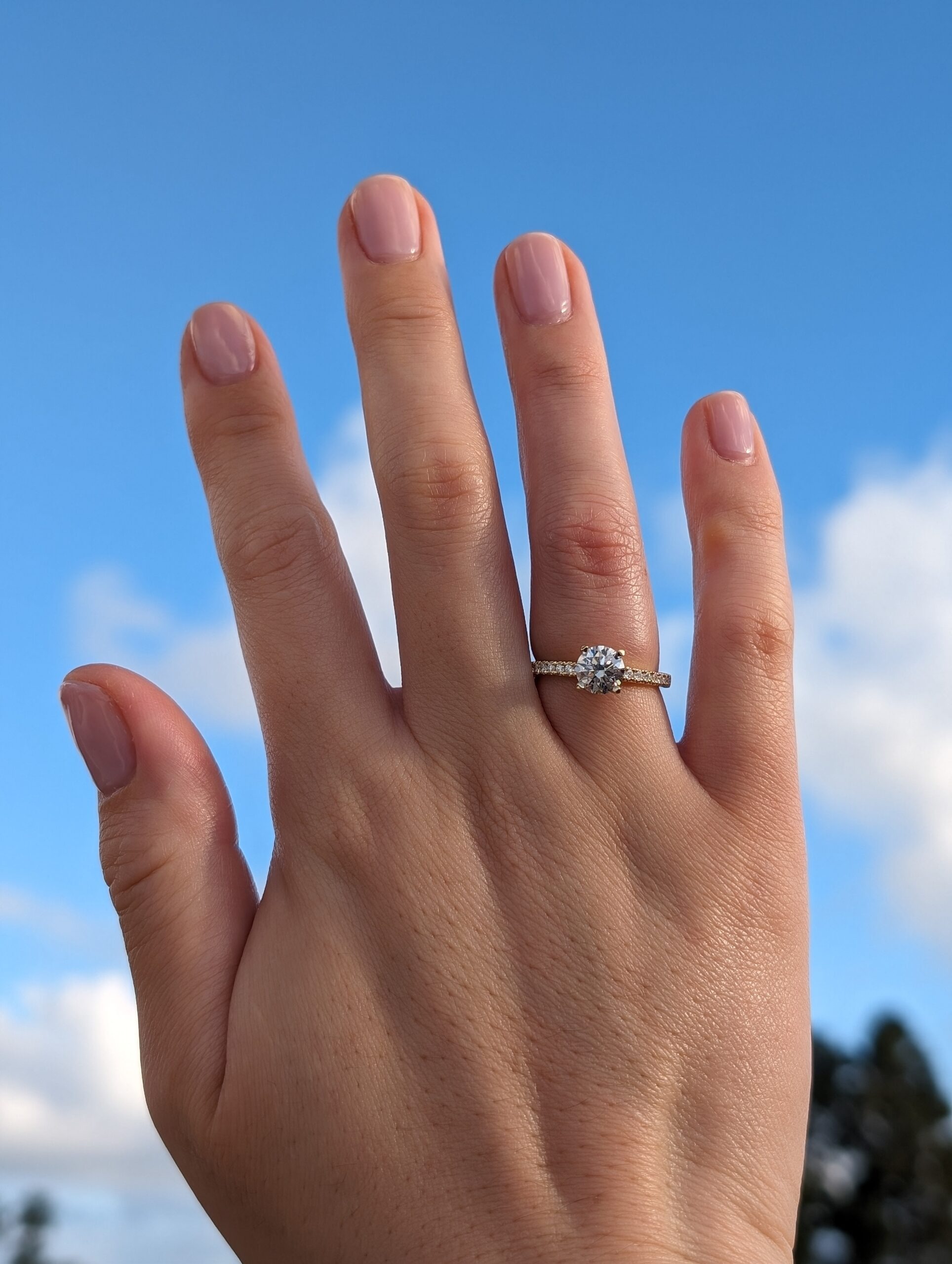 The 1.11-carat round lab-grown diamond ring on hand. With Clarity engagement ring on hand